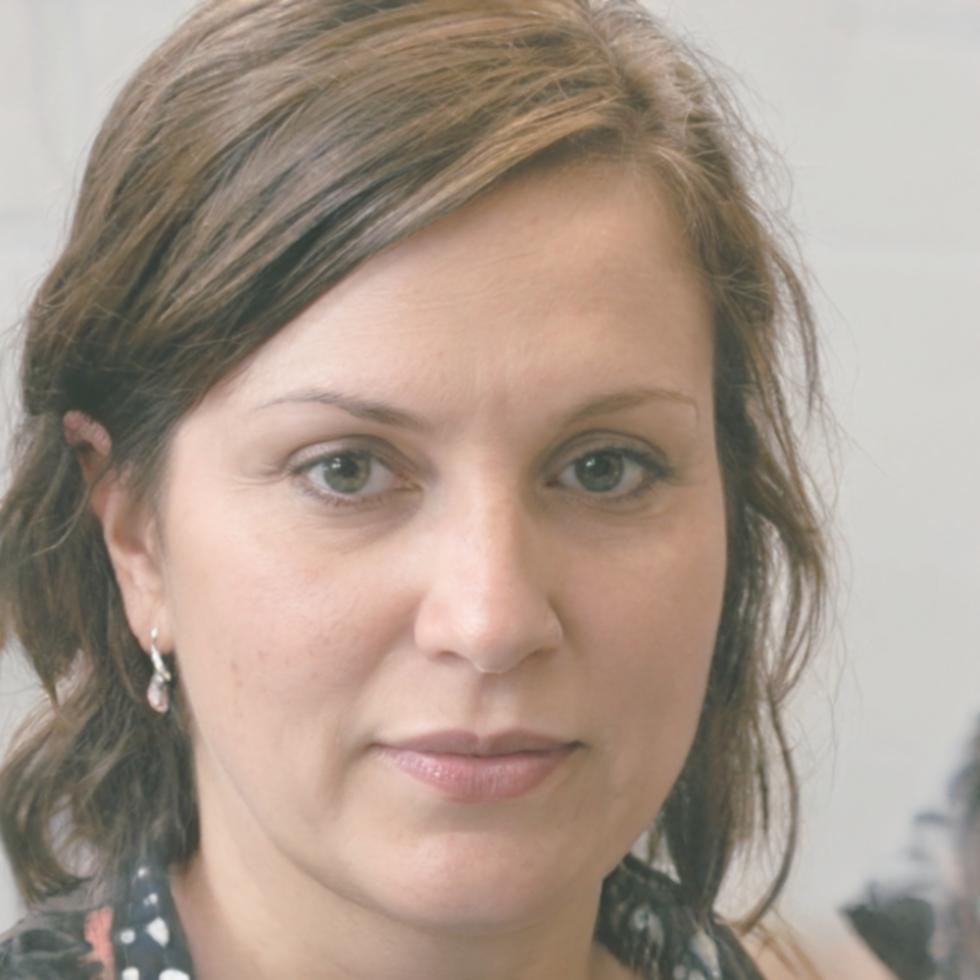 Siobhan Kavanaugh reviewing financial forecasting materials at the Elanora office